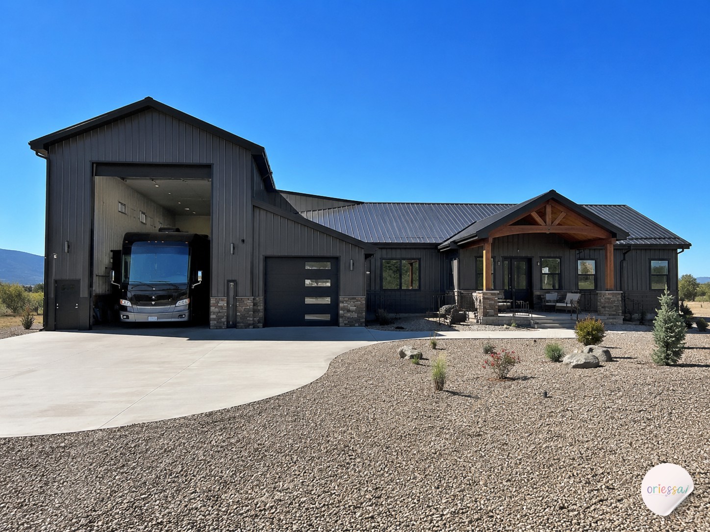 Barndominium with extra tall attached RV garage bay