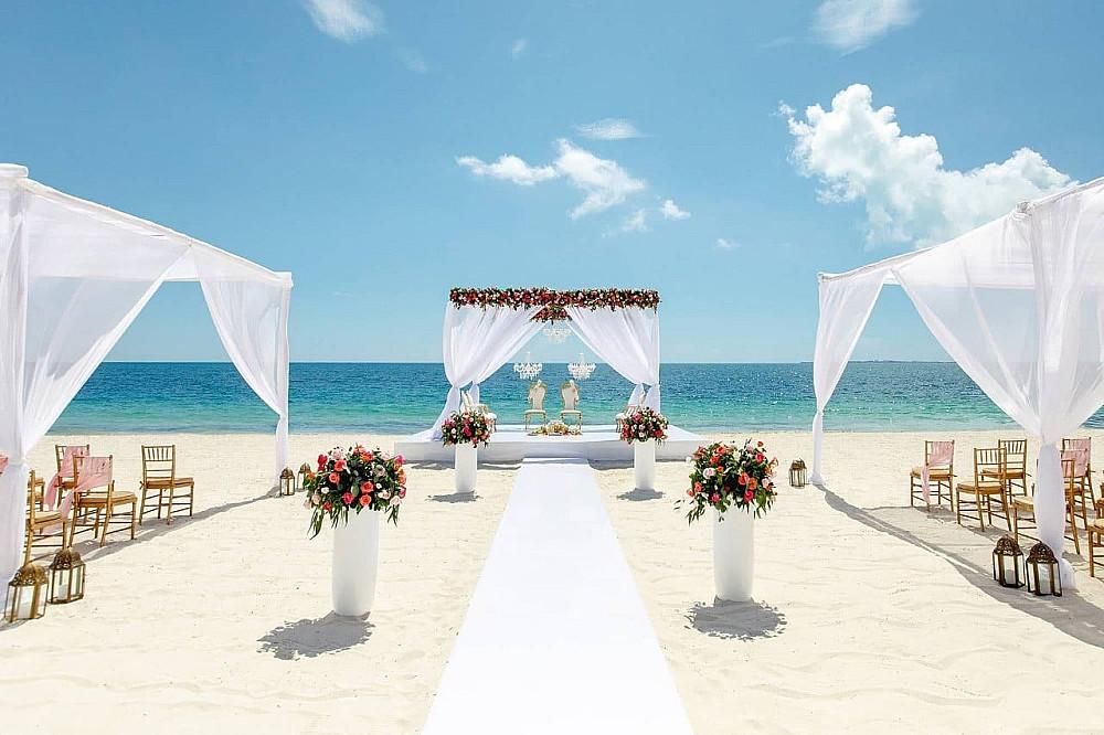 Beach wedding ceremony by ocean