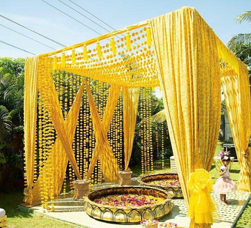 DIY yellow drapes haldi setup