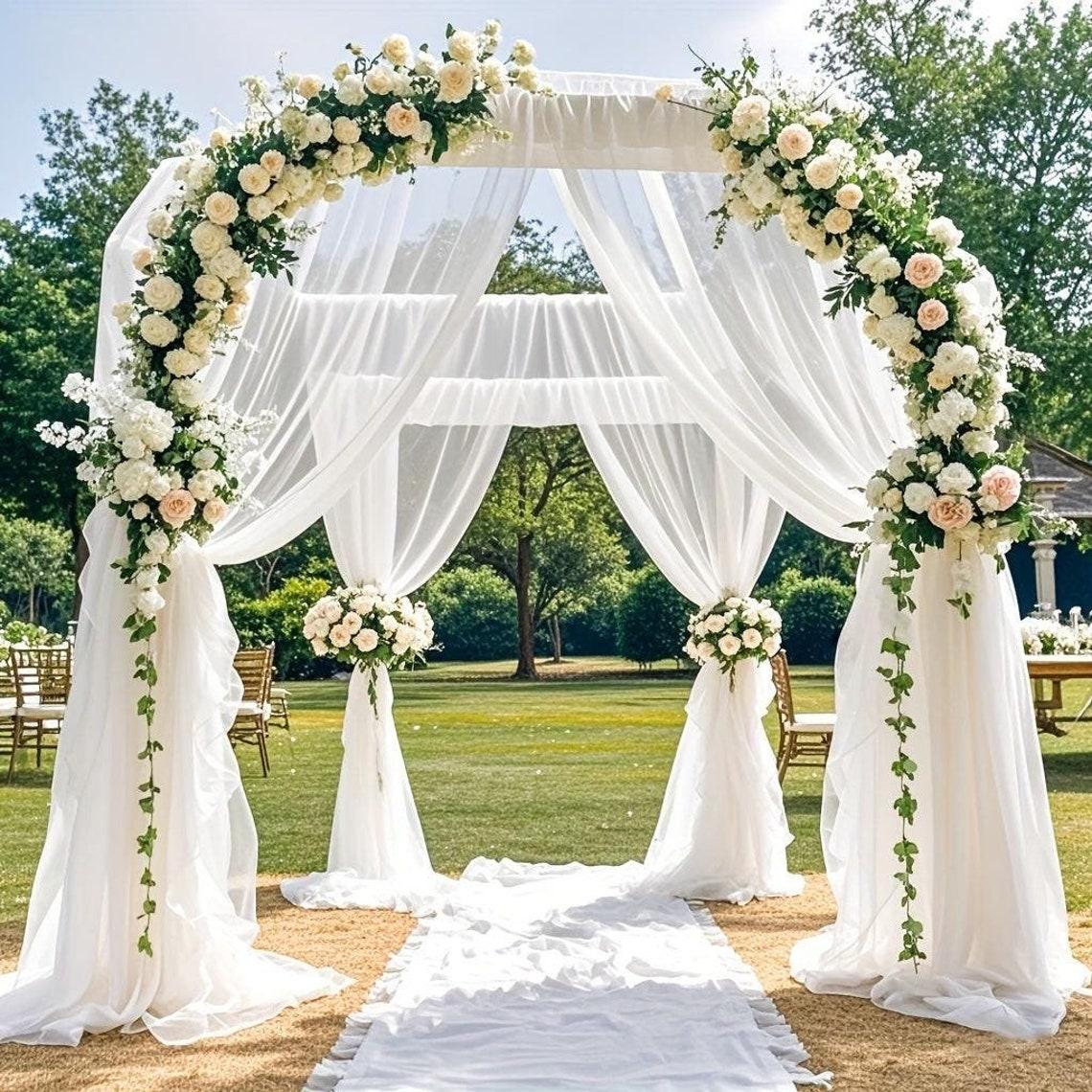 Wedding arch with flowing fabric drapes