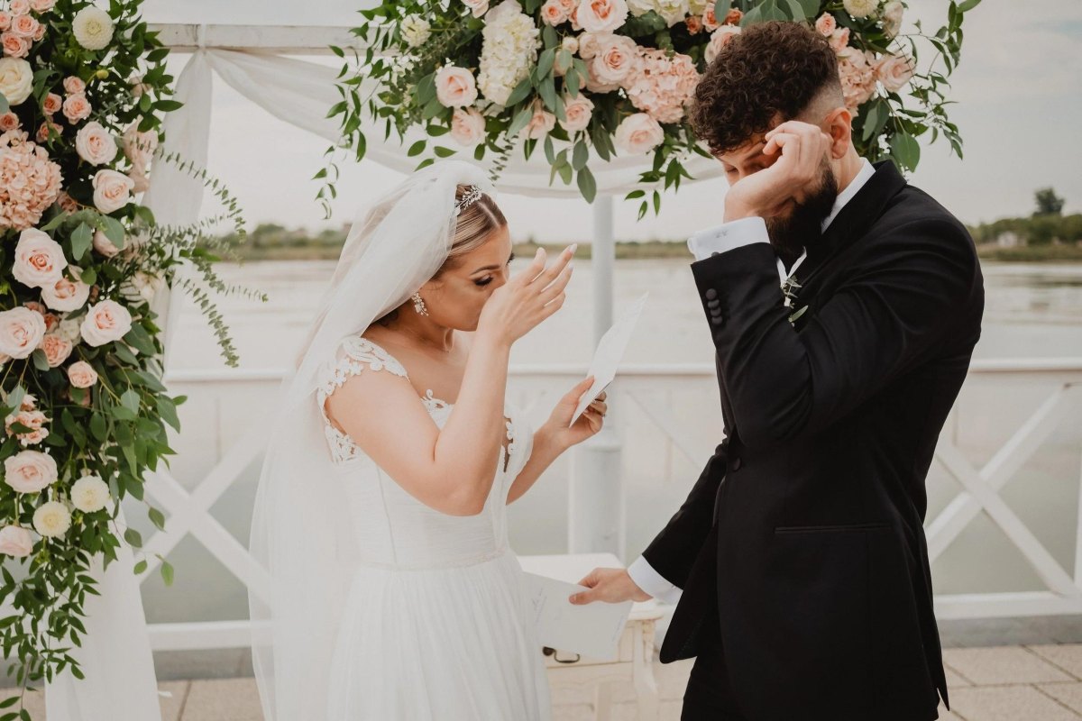 Emotional bride and groom exchanging vows