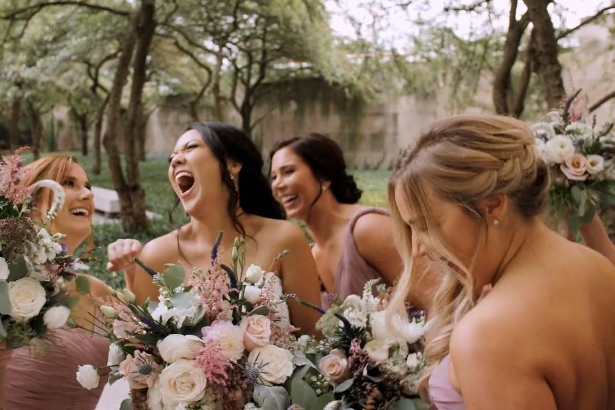 Bridesmaids laughing at wedding reception
