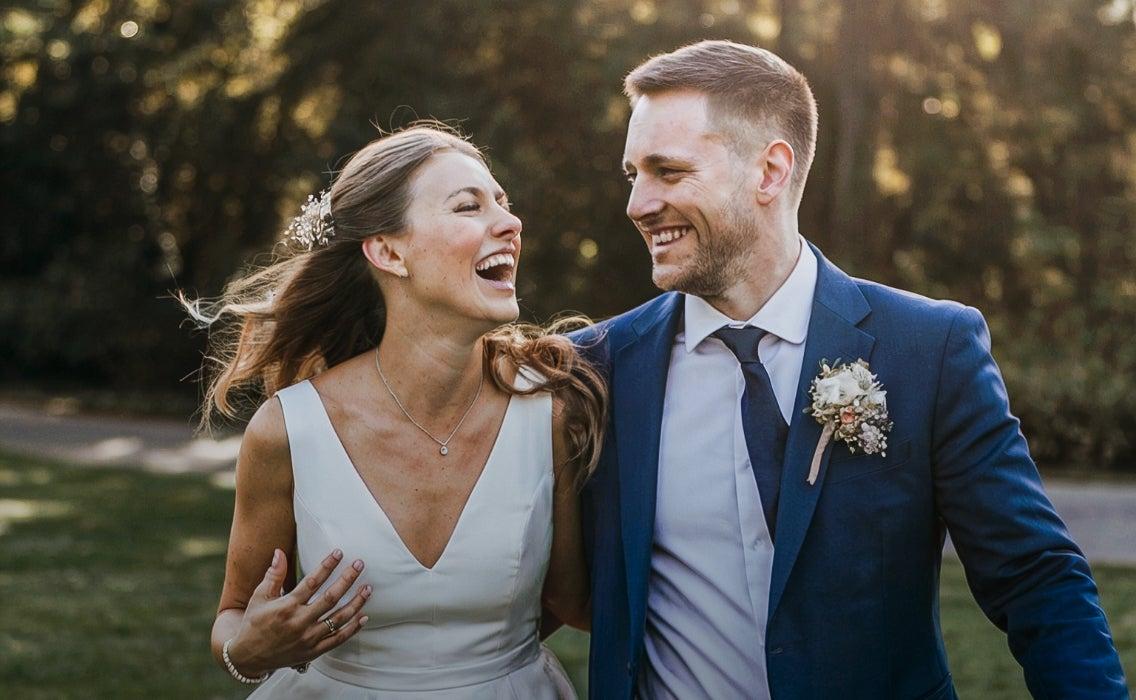 Newlywed couple laughing together
