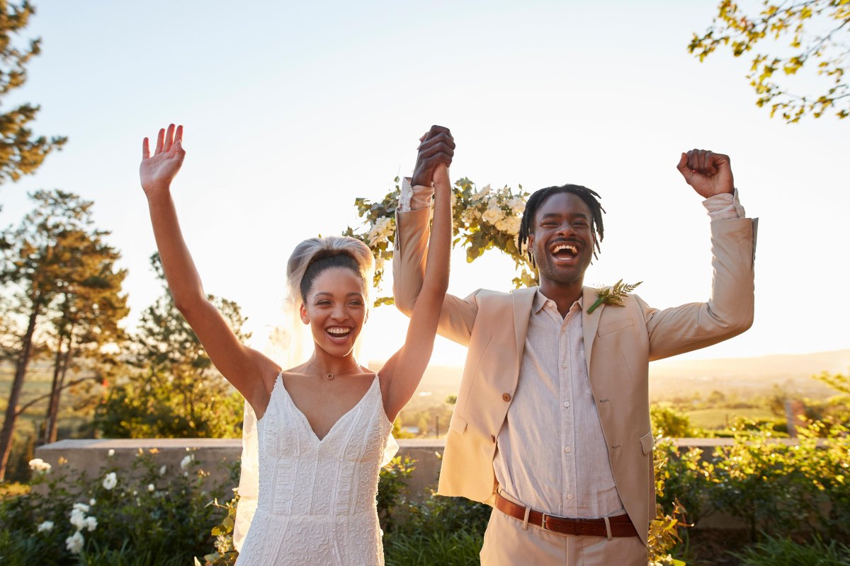 Modern couple celebrating outdoor wedding