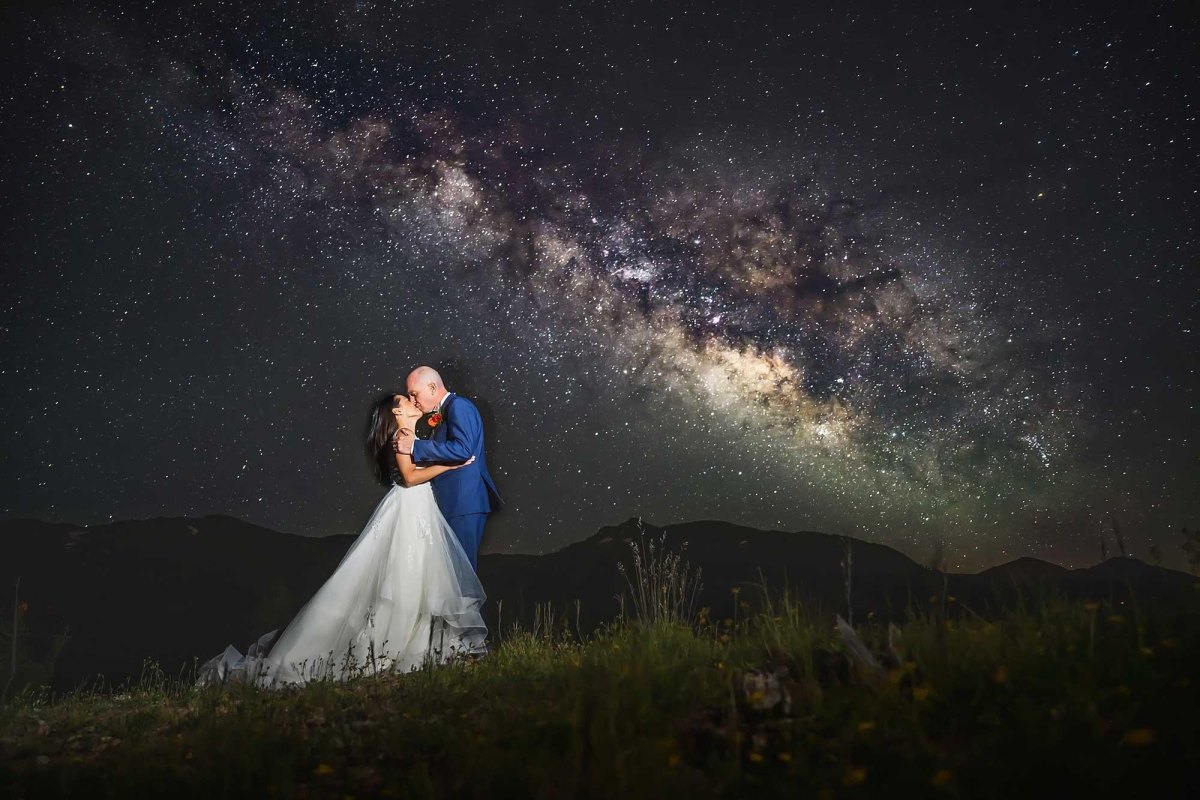 Couple under stars during nighttime elopement