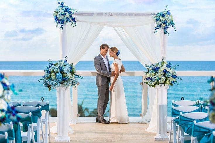 Ocean blue ivory seaside wedding setup