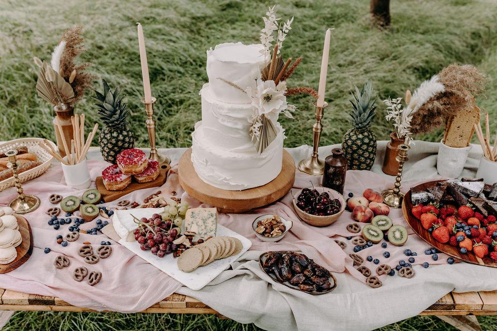 Outdoor wedding picnic dessert station