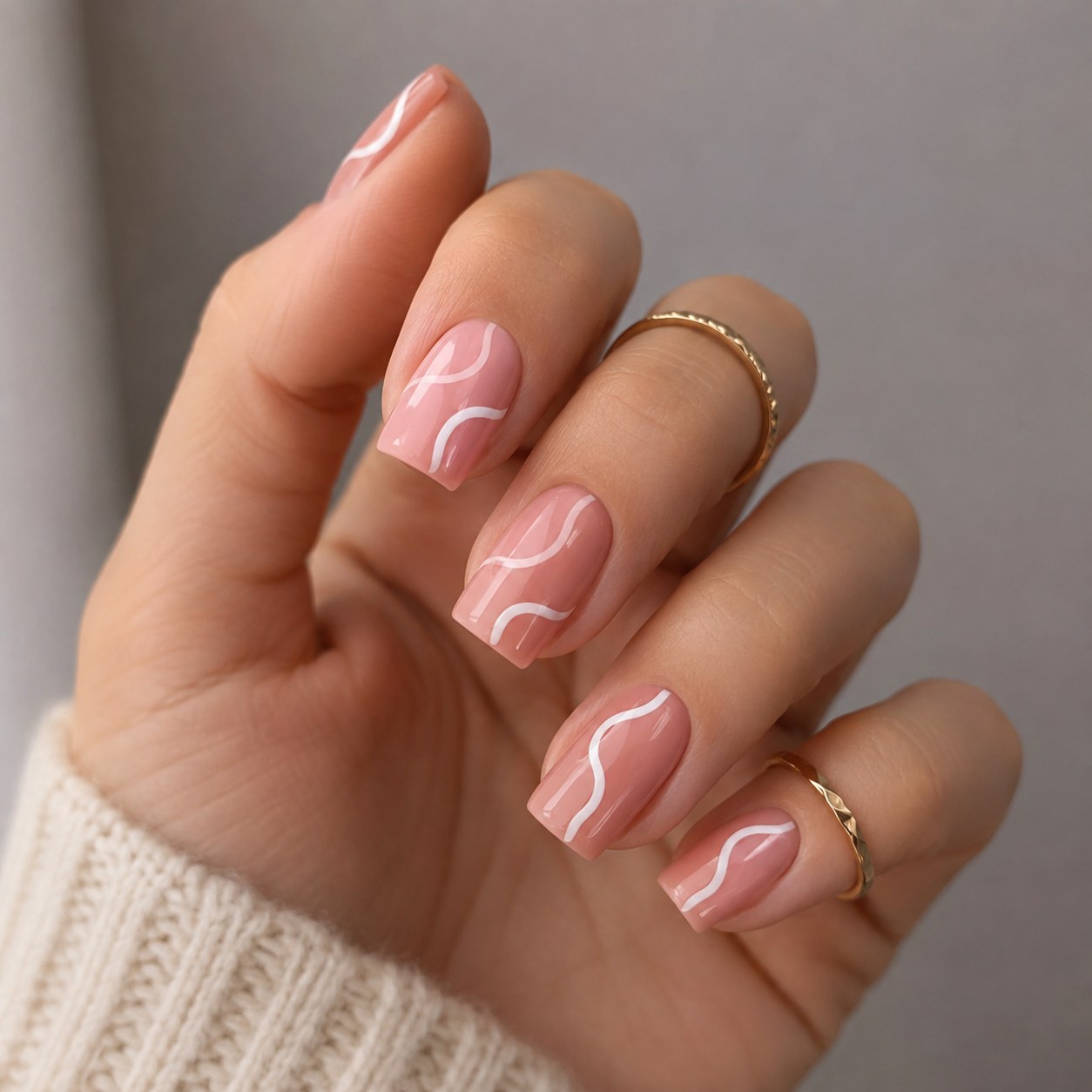 Short square pink nails with abstract white swirl line art, easy to adapt to coffin tips
