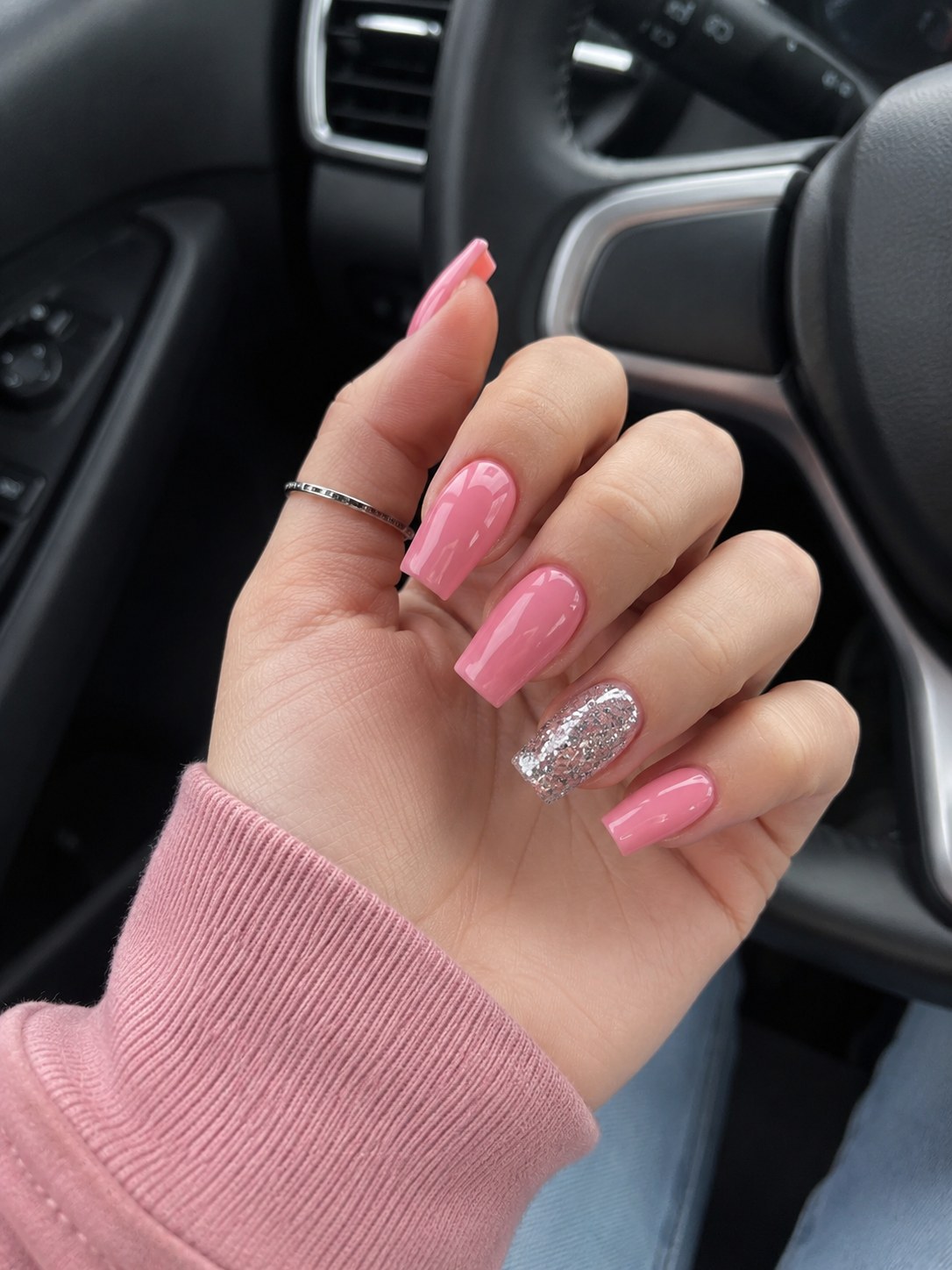 Glossy bubblegum pink coffin nails with a single silver glitter accent finger