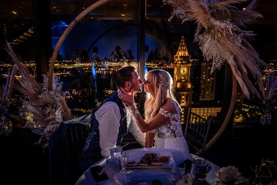 Rooftop dinner city lights wedding couple