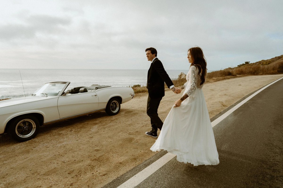 Couple road trip elopement with vintage car