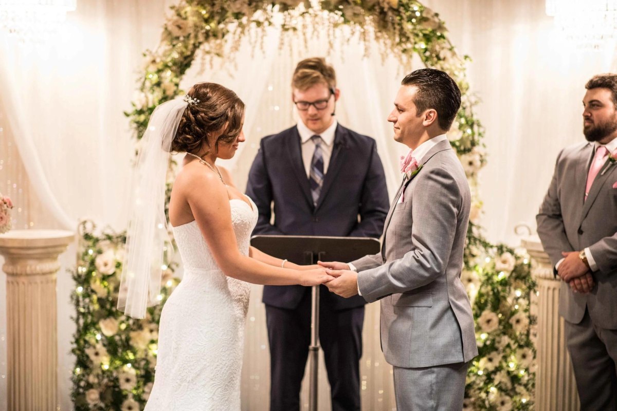 Newlyweds holding hands after ceremony