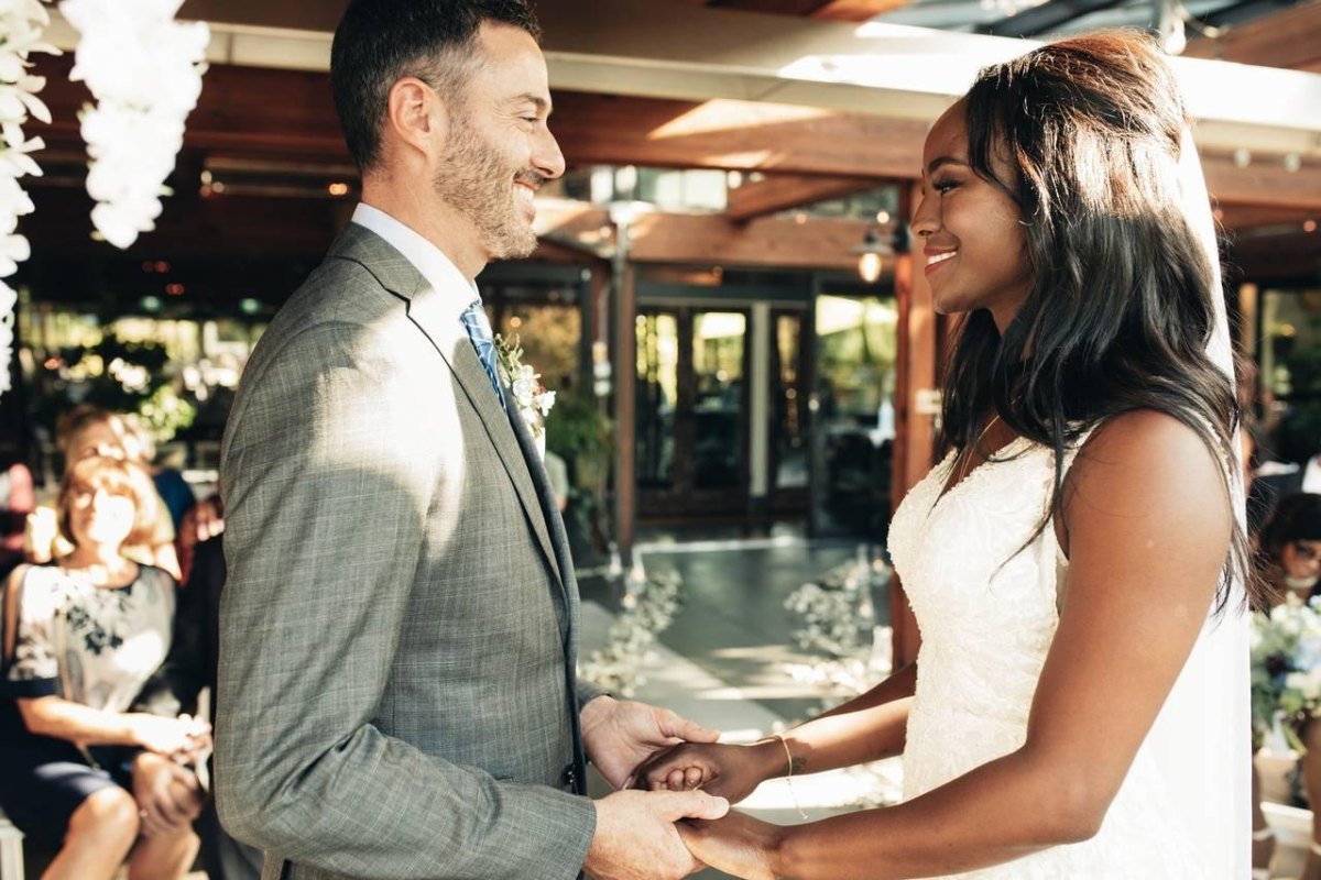 Bride and groom smiling during ceremony