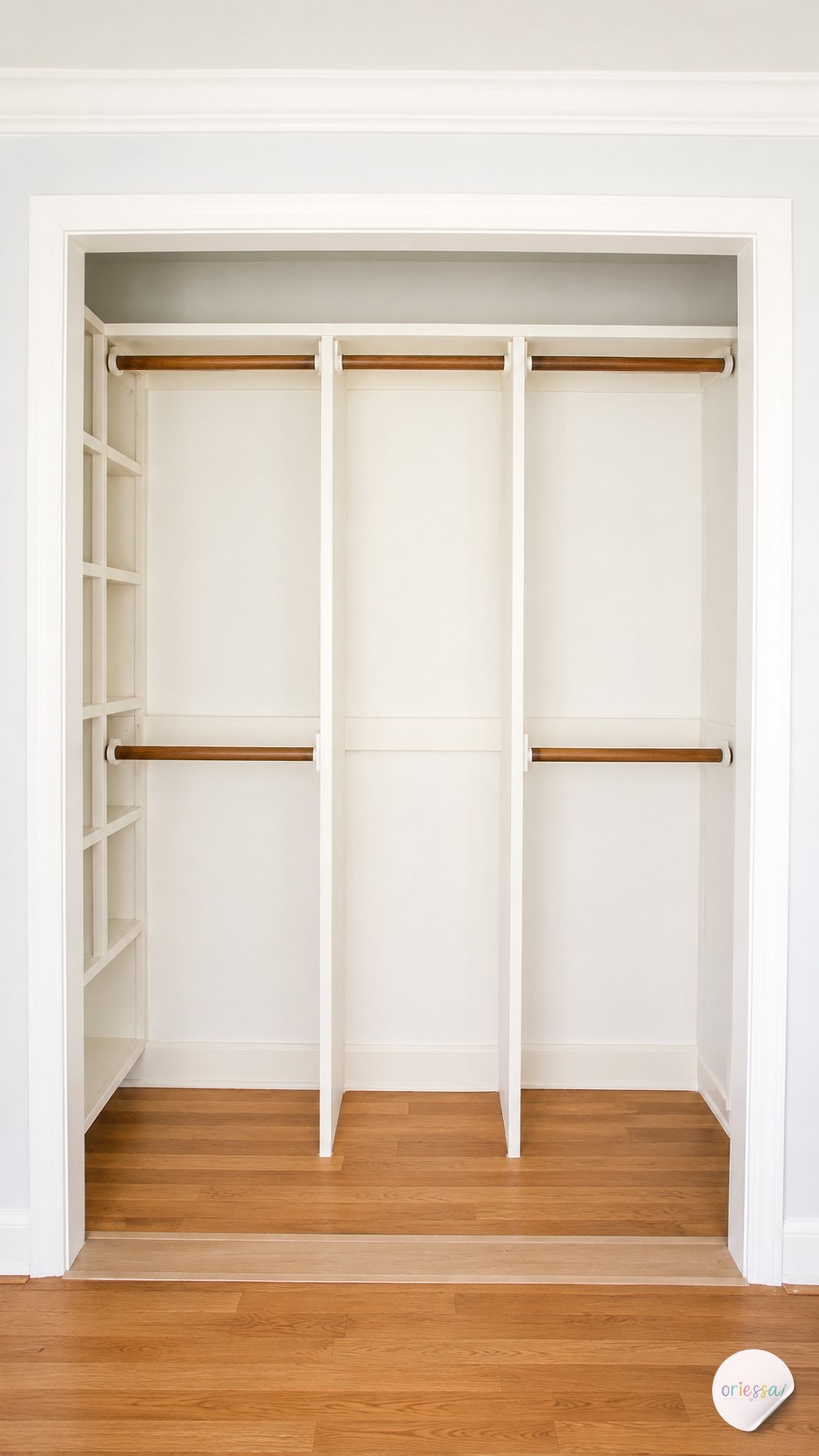 A hanging shelf-and-rod combo unit adds folded storage above an existing rod in a tight closet.