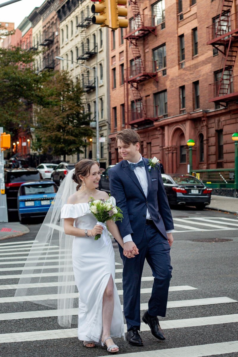 Couple walking city streets wedding photography