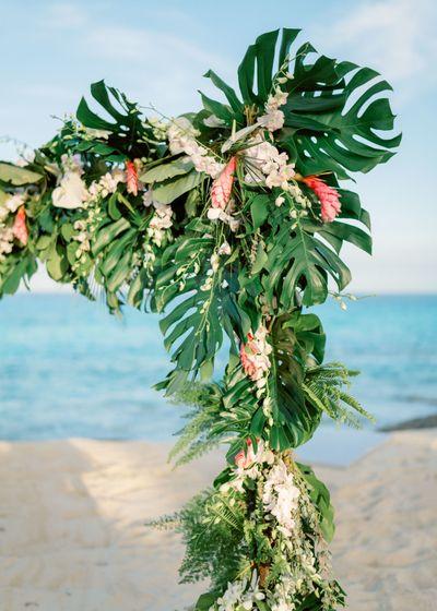 Tropical greenery wedding arch decoration