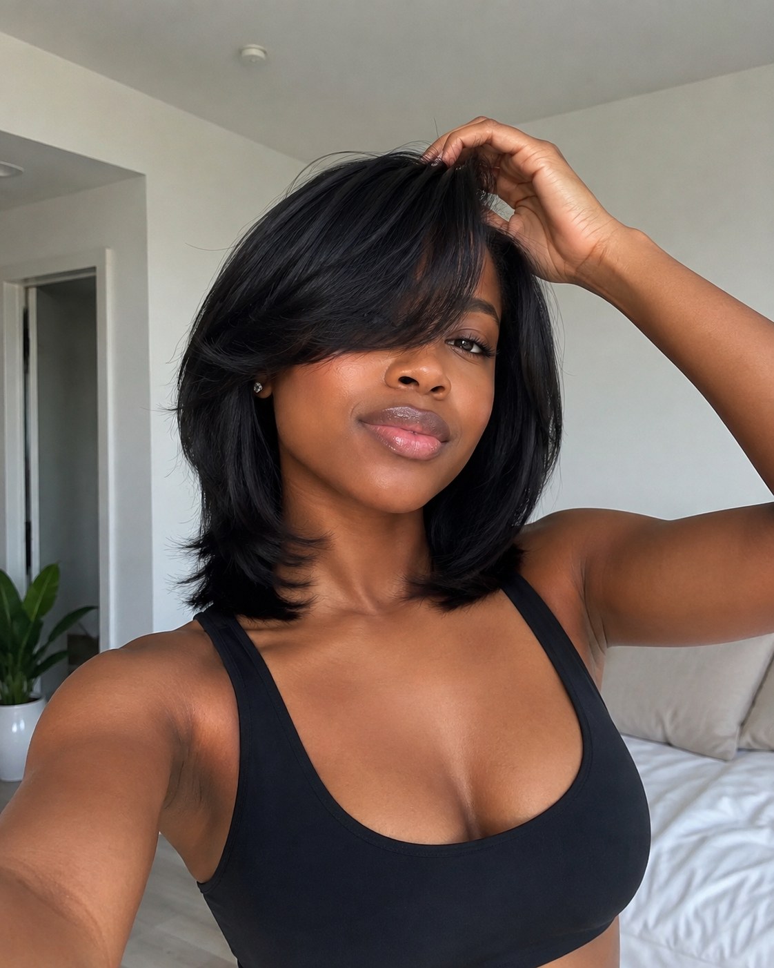 Shoulder-length curtain-bang bob with flipped ends, a volume haircut for thin hair