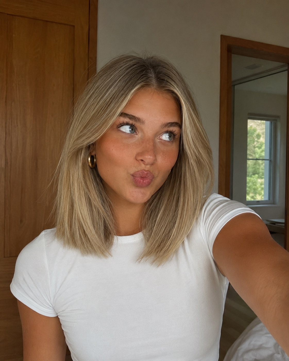 Blunt lob with invisible internal layers, a dense-looking volume haircut for thin hair