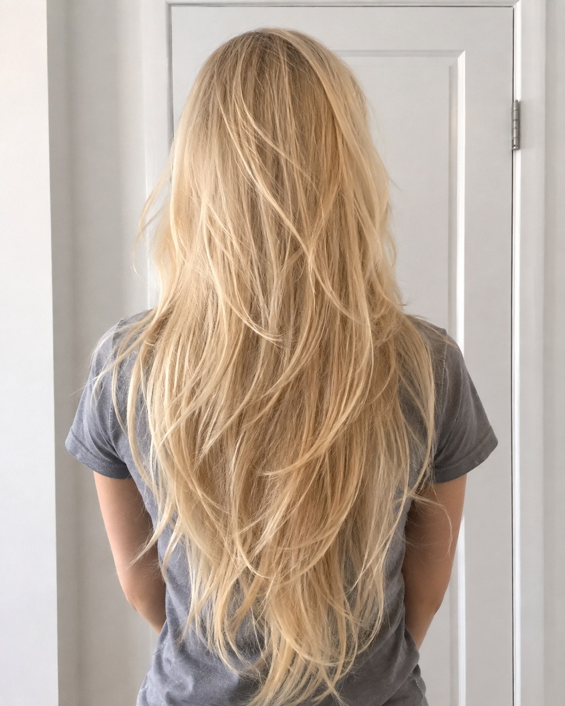 Extra-long layered flip haircut showing V-shaped layers designed to add body to thin hair